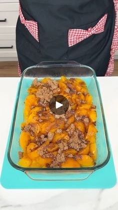 a casserole dish with meat and vegetables in it sitting on a blue tray