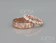 two rose gold wedding bands with diamonds on them, set against a grey background and the words asocca above it