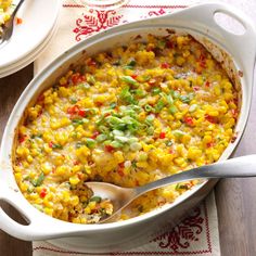 a casserole dish filled with corn and vegetables