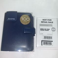 a note book next to an unopened package