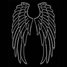 an angel wings with white crystals on black background