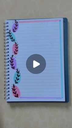 an open notebook with a video playing on it