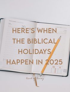 an open book with a pencil on it and the words here's when the biblical holidays happen in 205