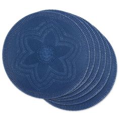 four blue placemats with an intricate design on the top and bottom, set of 4