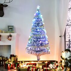 a decorated christmas tree in the corner of a living room