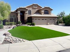 a house with grass in the front yard