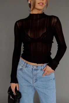 DETAILS: Our Brielle Sheer Long Sleeve Top is a statement piece! This top is completly sheer with long sleeves and a high neckline. It is lightweight with a ribbed look and texture to the fabric. We suggest pairing it with a bralette under. There is plenty of stretch and it fits true to size. Pair this top with any bottom for a cute look! CONTENT & CARE: SELF: 89% Viscose, 11% Nylon. SIZE & FIT: Model is 5'6" The model is wearing a size Small. Fits true to size The Fabric has stretch Sheer Undershirt Long Sleeve Outfit, Sheer Undershirt Long Sleeve, Long Sleeve Going Out Tops, Long Sleeve Mesh Top Outfit, Black Transparent Top Outfit, Mesh Long Sleeve Top Outfit Layered, Transparent Top Outfit, Mesh Long Sleeve Top Outfit, Sheer Tops For Women