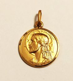 Jesus medal pendant:metal           : 10k solid yellow goldmade          : in Italyvariations  :length=0.75"inch(18mm)including the bail/weight=1.3gr/diameter=12mm/bail=2x5mm                    length=1"inch      (23mm)including the bail/weight=2.9gr/diameter=17mm/bail=3x6mm Gold Pendants For Men, Pendant For Men, Cute Box, Evil Eye Pendant, Solid Yellow, Snake Chain, Precious Metals, Gold Pendant, Pocket Watch