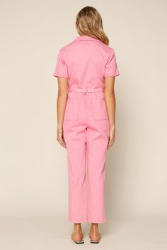 A playful spin on utilitarian style, this short-sleeve jumpsuit comes in a pink shade that's just so much fun to wear. It's a one-and-done outfit with a self-tie belt and pockets galore. Simply cuff up the ankles and add a fresh pair of sneakers. •Notched collar •Button placket •Short sleeves •Patch pockets •Optional s Pink Utility Jumpsuit, Nfr Rodeo, Denim Utility Jumpsuit, Jumpsuit Pink, Jump For Joy, Utility Jumpsuit, Utilitarian Style, Pink Jumpsuit, Short Sleeve Jumpsuits