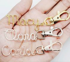 there are three pairs of scissors in someone's hand with the word mary louna condad written on them