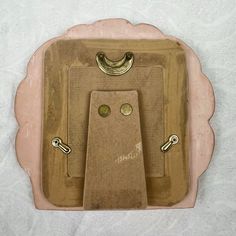 a light switch cover with two brass handles on the front and back of it's cover