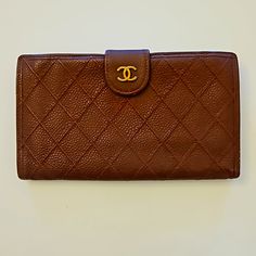 Chanel V Stitch Kiss Lock Long Leather Vintage Wallet In Maroon W/ Gold Hardware. This Is A Vintage Preloved Piece With Some Minor Wear. Inside Is Clean. Gold Hardware. Kiss Lock And Snap Is Working Great Condition. There Is Some Very Minor Peeling In The Leather On The Corners. Some Scratches As Expected For A Vintage Piece. The Inside Has Very Light Penmarks In One Spot. There Is A Serial Number Sticker, But The Protective Sticker Has Peeled Off And Is Unclear. Please Check The Images For More Designer Leather Travel Wallet, Designer Leather Bifold Clutch, Designer Leather Clutch Wallet, Designer Brown Clutch Wallet, Designer Textured Leather Rectangular Wallet, Designer Textured Leather Wallet, Designer Textured Leather Wallets For Everyday, Vintage Wallet, V Stitch