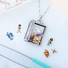 an image of some disney characters on a white table with glasses and other items around it