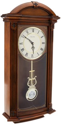 an old fashioned clock with roman numerals on the face