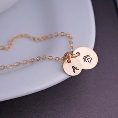 A 14k gold filled 12mm (1/2 inch) disc is hand stamped with a paw print is hanging from a 14k gold filled chain. Available in 18 or 20 inches. Round Pendant Necklace With Paw Print For Gift, Gold Paw Print Jewelry For Best Friend Gift, Gold Paw Print Jewelry For Best Friend, Paw Print Round Pendant Jewelry For Gift, Paw Print Round Pendant Jewelry As Gift, Paw Print Round Pendant Jewelry Gift, Paw Print Necklaces For Valentine's Day Gift, Gold Paw Print Jewelry For Mother's Day, Valentine's Day Gift Necklaces With Paw Print