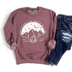 Looking for a cute versatile top to wear? Make sure to grab one of our Graphic Sweatshirts! This soft and comfortable shirt is the perfect top for any outfit. It can be paired with biker shorts, Jeans, or the classic stay at home sweats! This sweatshirt is true-to-size, so be sure to order your regular size! If you are looking for a more oversized look, make sure to size up. Fall Adventure Top With Graphic Print, Fall Adventure Graphic Print Top, Graphic Print Top For Adventure In Fall, Crew Neck Sweatshirt For Camping, Fall Camping T-shirt With Letter Print, Relaxed Fit Graphic Sweatshirt For Camping, Fall Long Sleeve Tops For Camping, Relaxed Cotton Sweatshirt For Camping, Cotton Relaxed Fit Sweatshirt For Camping