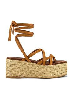 Chic Comfort: ALOHAS Wedge Sandals (One Torn Strap Fixed)! Luxe Leather Upper: Camel color for a stylish touch. Comfort & Security: Wrap-ankle tie and leather lining. Wedge Heel with Platform (3" wedge, 2.75" platform): Height with comfort. Crisscross Straps: Trendy and secure design. Repaired Minor Tear: Fixed one torn strap. Not noticeable while wearing. See photo. Made in Spain Paw Paw, Future Trends, Platform Espadrilles, Camel Color, Shoe Style, Sandal Espadrille, Wedge Heels, Wedge Sandals, Fashion Brand