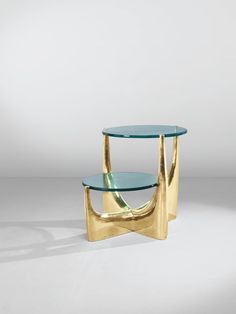 a table with two glass shelves on it