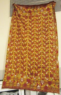 A stunning vintage handcrafted woven and embroidered large textile panel , folk art wedding shawl from Piatala Punjab with exquisite floral and stylized motifs of mostly infinite intricate variations of wheat and barley ears embroidered with darn stich colorful yellow gold silk floss on coarse dyed dark red connected separate background cloths as you can see from the pictures It is in excellent vintage condition with differerring unique intricate panel embroidered borders also showing exquisite Vintage Embroidered Dupatta For Festivals, Embroidered Fabric With Woven Motifs For Festivals, Vintage Embroidered Fabric With Traditional Patterns For Festivals, Bohemian Chanderi Fabric With Traditional Embroidery, Ceremonial Folk Dupatta With Motifs, Vintage Traditional Dupatta For Festivals, Bohemian Chanderi Embroidered Fabric With Traditional Patterns, Festival Chanderi Fabric With Woven Motifs, Vintage Dupatta For Festivals With Traditional Drape