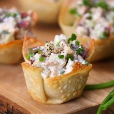 small appetizers are sitting on a cutting board