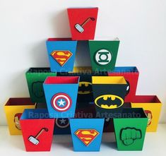 a bunch of boxes that are shaped like superheros and batman's logos on them