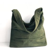 Please check 'shop announcement' for production time and delivery before your purchase.  This gorgeous bag is made from forest green pure hemp material. I really love its unique texture and the ruggedness of hemp, giving you a different feeling from other kinds of fabric. This everyday bag is sturdy and roomy enough to hold your essentials, such as books, wallet, Ipad, mobile and keys. It's fully lined with canvas, there are 2 slip pockets, one zipper pocket  and a pen slip inside. The strap has been interfaced with poly-fleece for your extra comfort.  A zipper closure keeps all of your items secure. If you prefer this bag to be with a magnetic snap please let me know. You can select the colors from the option menu in this listing. I make each bag individually by hand with lots of care, so Green Canvas Bag For Daily Use, Green Satchel Canvas Bag For Everyday, Green Hobo Bag With Pockets For Daily Use, Eco-friendly Square Shoulder Bag For Everyday, Green Bag With Pockets For Everyday Use, Green Canvas Tote Bag For Everyday, Green Canvas Shoulder Bag For Everyday Use, Green Everyday Tote Canvas Bag, Green Everyday Bag With Pockets