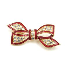 "Estate vintage red enamel & clear rhinestone bow brooch. This piece is a large statement! Perfect for a jacket lapel, a hat or a bag. Unmarked/unsigned. In good vintage condition; no significant signs of wear. Measurement: 2.88\" long x 1.27\" tall Weighs: 18.68 grams More love tokens in the shop: Victorian sweetheart brooch - https://etsy.me/3u9OWpR Sterling heart bangle - https://etsy.me/3Hjth27 *Free Shipping on Domestic Orders Over $35* All items ship USPS First Class. If you would like to Retro Rhinestone Brooches For Gifts, Red Enamel Pins For Gifts, Vintage Red Pins For Party, Elegant Red Holiday Brooch, Elegant Red Holiday Brooches, Bow Brooch, Love Token, Rhinestone Bow, Stick Pins