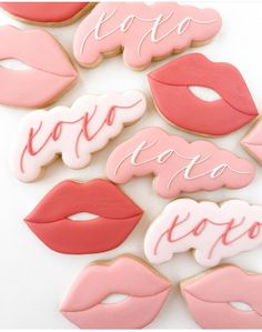 cookies decorated to look like lips and kisses are arranged in the shape of letters that spell out love