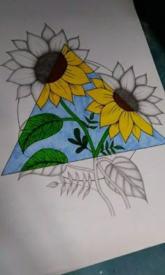 a drawing of two sunflowers on a piece of paper