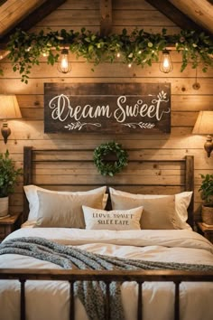 a bed with pillows and blankets on top of it in a room that has wooden walls