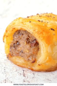 there is a pastry with meat inside of it