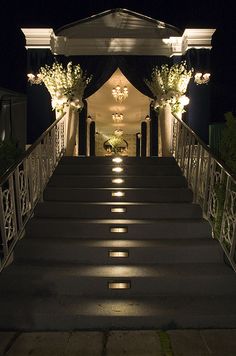 stairs lit up at night with flowers on each step and the words don't forget the entrance