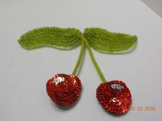 "Vintage red cherries brooch. 3\" x 4\" with a standard working fastener. 3/4\" diameter cherries with red & silver sequins; green threaded stems and lime green beaded leaves. This is gorgeous!! Excellent condition." Red Beaded Brooch For Party, Beaded Leaves, Sweater Clip, Beaded Leaf, Heart Brooch, Green Beads, Purple Rhinestone, Red Sequin, Vintage Heart