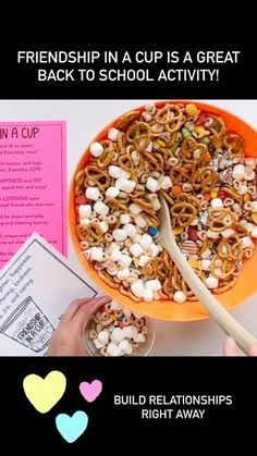 a bowl filled with cereal and marshmallows on top of a table