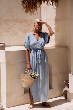 Melody Maxi Dress | Powder Blue Chic Flowy V-neck Wrap Dress, Chic V-neck Wrap Dress For Day Out, Summer V-neck Wrap Dress For Brunch, Blue V-neck Wrap Dress With Tie Waist, Blue Flowy Wrap Dress, Maxi Length V-neck Dress With Tie Waist For Brunch, Brunch Maxi V-neck Dress With Tie Waist, Brunch V-neck Maxi Dress With Tie Waist, Blue Maxi Length V-neck Dress For Brunch