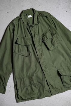 1960's Vintage US Army 2nd Type Junle Jacket  SIZE MR Shoulder：46cm Pit to pit：60cm Length：79cm Sleeve：60cm  Find us: @ban_secondhand_goods Thank you for checking us out :) Vintage Long Sleeve Utility Jacket For Streetwear, Vintage Khaki Outerwear With Patch Pockets, Vintage Green Utility Jacket For Work, Vintage Military Winter Utility Jacket, Retro Military Outerwear For Fall, Vintage Green Utility Jacket With Flap Pockets, 1960s Vintage, Us Army, Taiwan