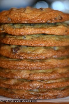 a stack of chocolate chip cookies sitting on top of each other