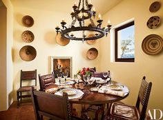 the dining room table is set with place settings