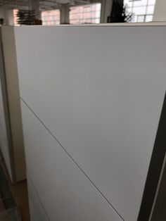 a close up view of the side of a white cabinet