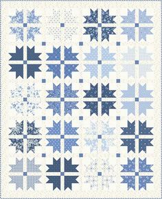 a blue and white quilt with stars on it