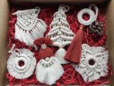 a box filled with christmas ornaments and tassels