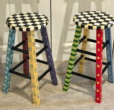 two colorful stools with designs on them