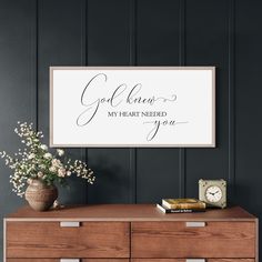 a sign that says god knows my heart needed you on the wall above a dresser