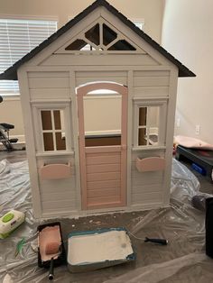 there is a doll house made out of plastic