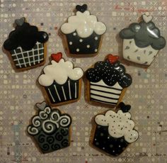 decorated cookies are arranged in the shape of cupcakes