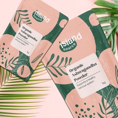 two packets of organic avocado planter on a pink background with palm leaves