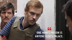 two men standing next to each other in front of a wall with a quote from the movie one man's prison is anyone else's palace