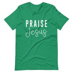 a green t - shirt with the words praise jesus printed in white on it's chest