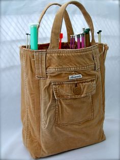 a brown bag filled with lots of different types of pens and pencils in it