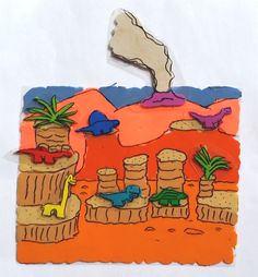 a piece of art that is made to look like a desert with animals and plants on it